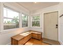 Cozy entryway featuring a wooden bench, bright natural light, and a welcoming front door at 4334 18Th N St, St Petersburg, FL 33714