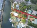 Waterfront property aerial view showing lush landscape at 6 Sea S Ln, St Petersburg, FL 33705