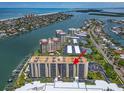 Stunning aerial view of a condo community with waterfront access and beautiful coastal scenery at 690 Island Way # 1011, Clearwater Beach, FL 33767