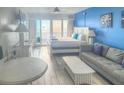Bright studio condo with a cozy seating area, large windows, and a view of the beach at 9980 Gulf Blvd # 603, Treasure Island, FL 33706