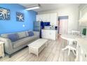 Comfortable studio condo offering a living area, kitchenette, and dining space with natural light at 9980 Gulf Blvd # 603, Treasure Island, FL 33706