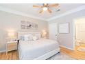 Serene bedroom with a cozy bed, soft lighting, and access to an en-suite bathroom at 10473 Villa View Cir, Tampa, FL 33647