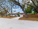 Lovely single-story home showcasing a well-maintained yard and a wood fence at 1700 25Th N St, St Petersburg, FL 33713