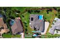 Aerial shot of property, highlighting backyard pool and landscaping. Property boundary lines are red at 2605 59Th S St, Gulfport, FL 33707