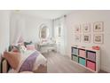 Charming bedroom featuring a bed, desk, and colorful storage, perfect for a room at 3269 Reservoir St, North Port, FL 34288