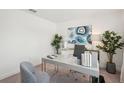 Bright and stylish home office featuring a sleek desk, modern decor, and ample natural light at 3269 Reservoir St, North Port, FL 34288