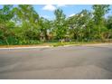 Street view of a cozy home with mature trees and a well-maintained lawn at 3611 W Reynolds St # 1/2, Plant City, FL 33563