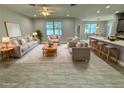 Open concept living room with tile floors and modern furniture at 37533 Teri Ct, Dade City, FL 33525