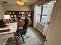 Cozy home office with built-in shelving and a large window for natural light at 37533 Teri Ct, Dade City, FL 33525