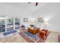 Cozy living area with tile flooring, sliding doors, and a neutral color palette at 826 Glades Ne Ct, St Petersburg, FL 33702