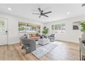 Inviting living room with natural light, comfortable seating, and hardwood floors at 1323 48Th N Ave, St Petersburg, FL 33703