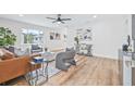 Bright living room featuring modern decor, stylish seating, and sleek ceiling fan at 1323 48Th N Ave, St Petersburg, FL 33703