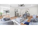 Spacious living room with contemporary furniture, modern accents, and hardwood floors at 1323 48Th N Ave, St Petersburg, FL 33703