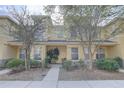 Inviting townhome with stone accents and covered porch, showcasing a well-kept exterior at 222 Draw Bridge Ln, Valrico, FL 33594