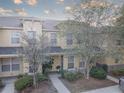 Charming townhome featuring a welcoming entrance, neutral paint and well-maintained landscaping at 222 Draw Bridge Ln, Valrico, FL 33594