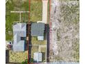 Aerial view of the property showcasing the lot layout with driveway, shed, and surrounding neighborhood at 2511 18Th N Ave, St Petersburg, FL 33713