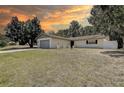Inviting single-Gathering home featuring a spacious front yard and a convenient attached two-car garage at 3728 Parkway Blvd, Land O Lakes, FL 34639