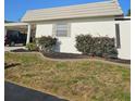 Well-manicured lawn and landscaping enhance this home's curb appeal at 4043 La Pasida Ln, New Port Richey, FL 34655