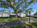 A large tree shades the well maintained exterior of this single story home at 4175 Northmeadow Cir # 4175, Tampa, FL 33618