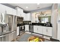 Well-equipped eat-in kitchen featuring stainless steel appliances and an open layout perfect for cooking and socializing at 5150 Bay Isle Cir, Clearwater, FL 33760