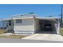 Cozy home with an attached carport providing convenient covered parking at 585 Sky Harbor Dr # 327, Clearwater, FL 33759