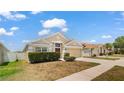 Attractive single-story home with a two-car garage, established landscaping, and a welcoming facade at 944 Ridge Haven Dr, Brandon, FL 33511