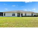 Inviting single-Gathering home with manicured front lawn and covered entryway at 11457 Cambray Creek Loop, Riverview, FL 33579