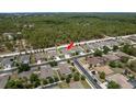 Overhead view of a home with lush green surroundings in a well-planned neighborhood at 13637 Blythewood Dr, Spring Hill, FL 34609