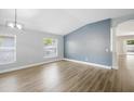 Unfurnished living room with hardwood floors and open-concept layout with ample natural light at 1924 Sean Wood Cir, Brandon, FL 33510