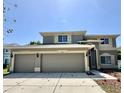 Charming two-story home with a three car garage and neutral color scheme at 2820 Pankaw Ln, Valrico, FL 33596
