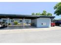 Exterior showing a car port with a compact car parked to the left and an SUV to the right at 3311 Teeside Dr, New Port Richey, FL 34655