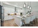 Bright eat-in kitchen showcases a center island, stainless steel appliances, and a modern design at 4517 Foley Grove Dr, Valrico, FL 33596