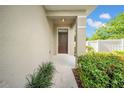 Charming front porch with neutral tones and manicured landscaping, creating a welcoming entrance at 5312 6Th N Way, St Petersburg, FL 33703