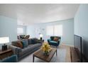 Comfortable living room with a couch, chairs, coffee table, and dining set at 11807 Raintree Lake Ln # B, Tampa, FL 33617