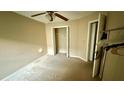 Cozy bedroom offering neutral walls, plush carpeting, closet space, and a ceiling fan at 1510 Sakonnet Ct, Brandon, FL 33511