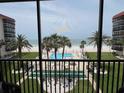 View from the balcony of the community pool, shuffleboard, beach and ocean at 18304 Gulf Blvd # 309, Redington Shores, FL 33708