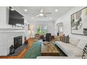 Inviting living room with fireplace, hardwood floors, and stylish contemporary decor at 3008 S Church Ave, Tampa, FL 33629