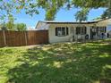 This property includes a spacious, fenced side yard perfect for outdoor activities or privacy at 315 Shore E Dr, Oldsmar, FL 34677