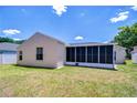 This home includes a screened in lanai, and a large well-maintained lawn and backyard at 316 Crystal Goblet Ct, Valrico, FL 33594