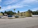 Palma Ceia Gardens Condominiums exterior shot showing building and parking at 3206 W Azeele St # 108, Tampa, FL 33609