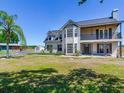 Two-story home with charming balcony and well-lit entry on a sprawling manicured lot at 3434 E Keysville Rd, Lithia, FL 33547