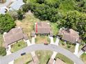 Overhead view of a well-maintained community featuring single-story homes with mature trees at 503 Finsbury Cir # A, Sun City Center, FL 33573