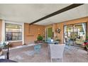 Cozy covered patio with ample seating, perfect for outdoor relaxation and entertaining at 5137 Springwood Dr, Tampa, FL 33624