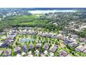 Beautiful aerial view of a residential neighborhood featuring a community pond and scenic lake at 1134 Tracey Ann Loop, Seffner, FL 33584