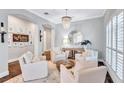 Bright living room features hardwood floors, recessed lighting and comfortable seating at 11624 Bristol Chase Dr, Tampa, FL 33626