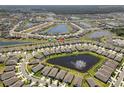 Community aerial view showcases the neighborhood's layout, lakes, and green spaces at 13227 Waterleaf Garden Cir, Riverview, FL 33579