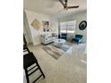 Bright living room featuring stylish furniture, modern decor, and lots of natural light at 2204 Euclid S Cir, Clearwater, FL 33764