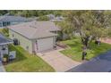 Aerial view of a well-maintained single-story home with a two-car garage at 29436 Zeller Ave, San Antonio, FL 33576