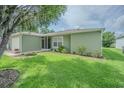 Well-maintained lawn and landscaping accent this single-story home's exterior at 29436 Zeller Ave, San Antonio, FL 33576