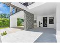 Spacious carport featuring modern tile flooring, stylish stone accents, and ample parking space at 3175 10Th N Ave, St Petersburg, FL 33713